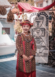 Yu-Chi Kalesekes Huang in traditional attire of Paiwan people