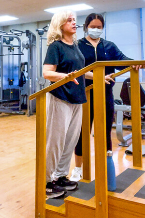 2 people doing physical therapy