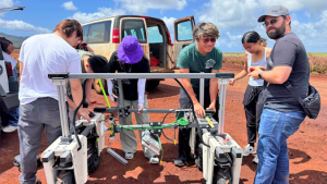 people working on a large robot