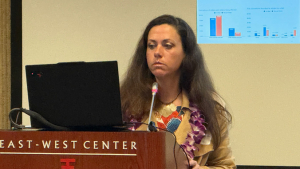 person speaking at a podium