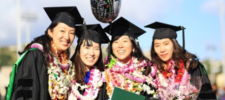 photo of 4 PhD graduates during graduation ceremony