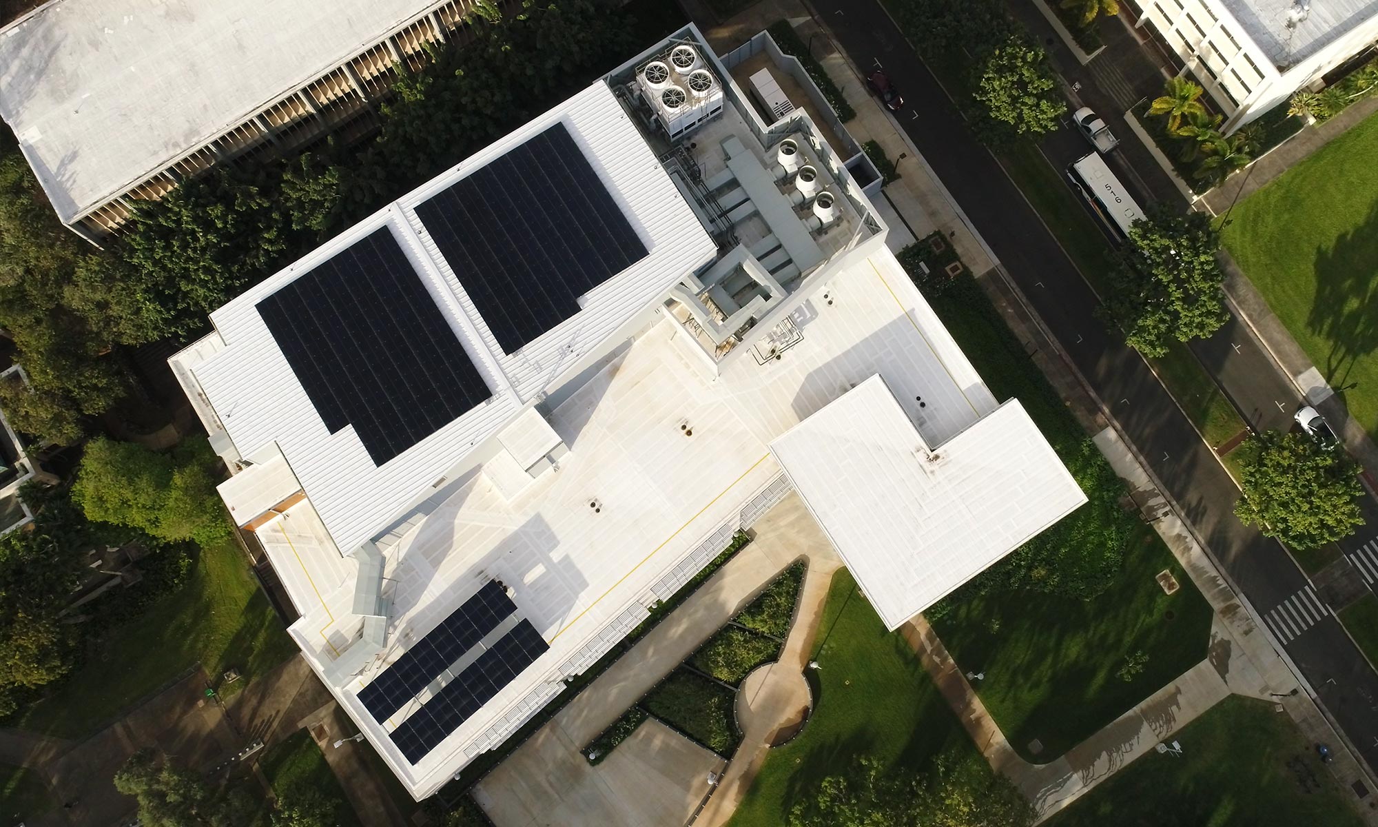 Aerial view of the Life Sciences Building showing rooftop photovoltaic panels.