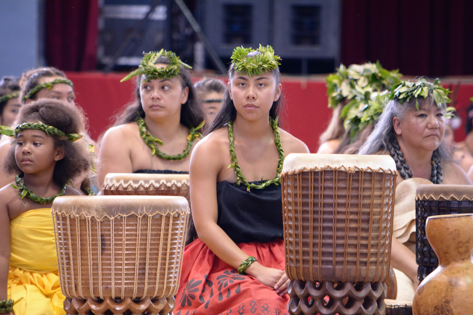 women in costume with drums