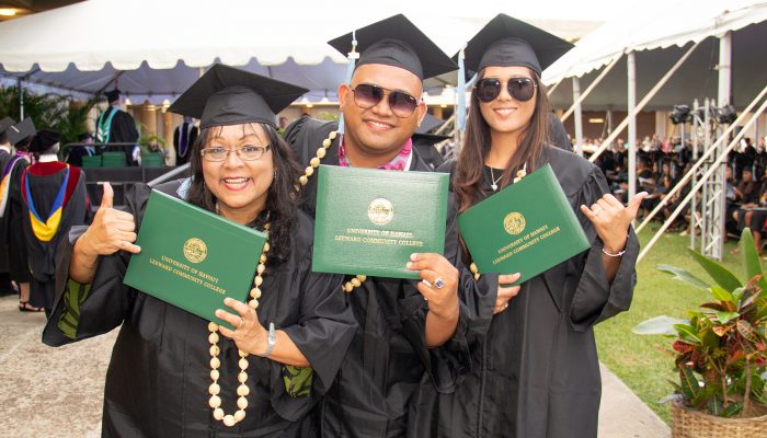 Students dress in cap and gown at commencement